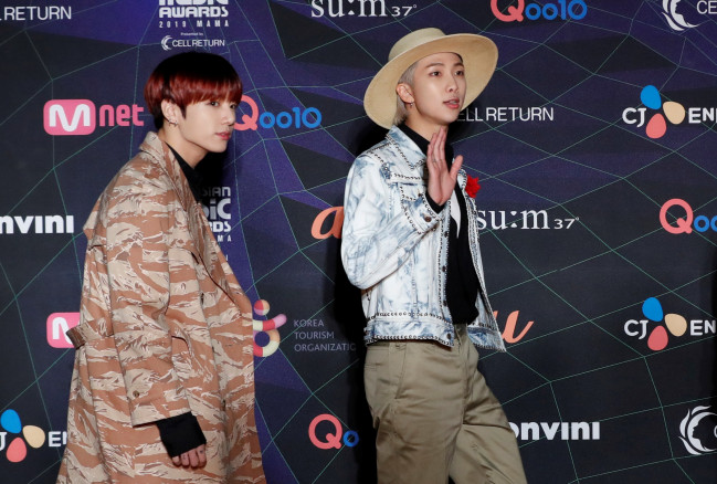 Jungkook and RM, members of South Korean boy band BTS arrive at the red carpet event during the annual MAMA Awards at Nagoya Dome in Nagoya