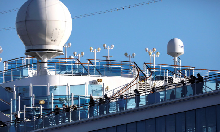 Passengers are seen on the cruise ship Diamond Princess, as the vessel's passengers continue to be tested for coronavirus, at Daikoku Pier Cruise Terminal in Yokohama, south of Tokyo