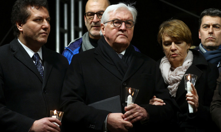 People attend a vigil for the victims of a shooting in Hanau