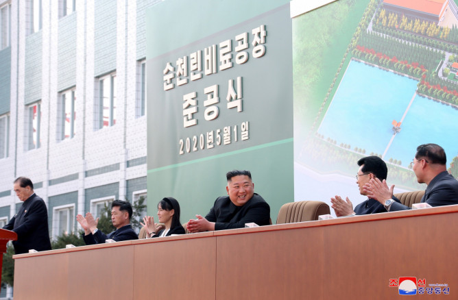 North Korean leader Kim Jong Un attends the completion of a fertiliser plant, together with his younger sister Kim Yo Jong
