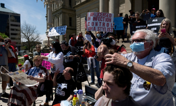 Supporters of the Michigan Conservative Coalition hold an "Operation Haircut" protest in Lansing