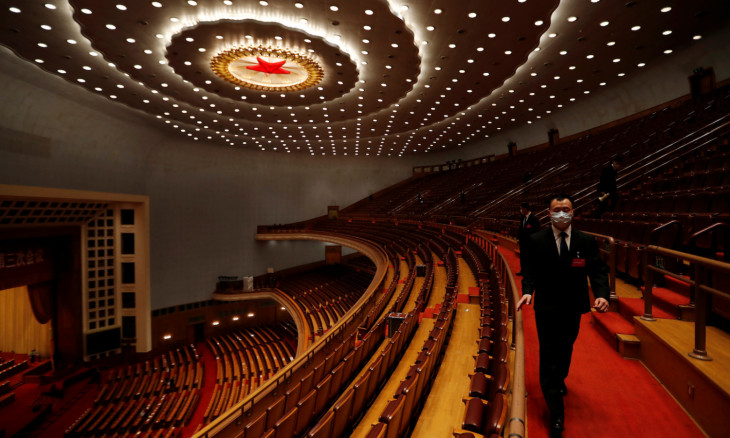 Security personnel inspect the venue at the end of the opening session of NPC in Beijing