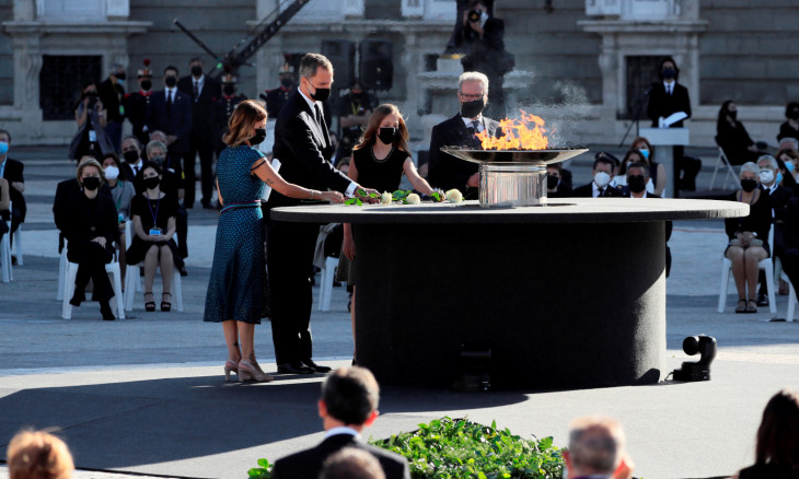 Spain's King Felipe, Princess Leonor, Aroa Lopez and Hernando Calleja place flowers a state tribute