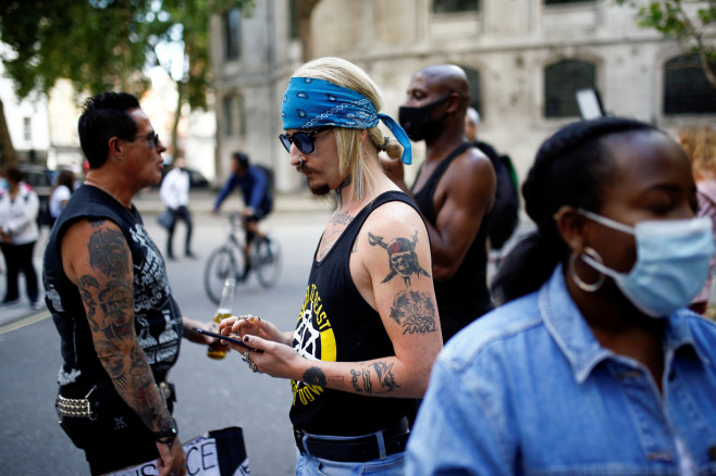 A supporter of actor Johnny Depp waits for him,