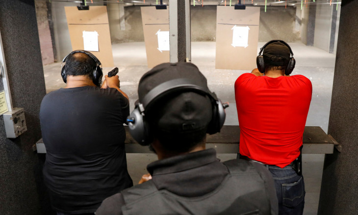 Members of the Hudson Valley Nubian Gun Club practice at a shooting range 