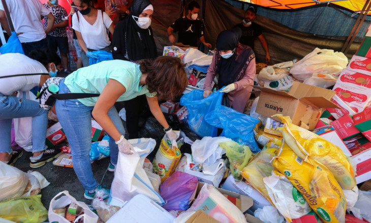 Volunteers gather aid supplies to be distributed
