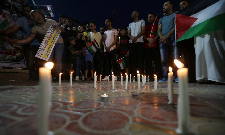 Palestinians light candles to show solidarity with the Lebanese people 