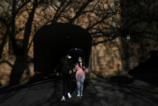 Sunny Gu and his girlfriend Maggie Zhang walk through the city centre