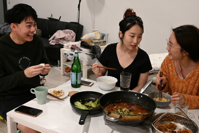 Sunny Gu, Maggie Zhang and Siyan Zhu  hare a traditional Chinese dinner before all three move back home to China