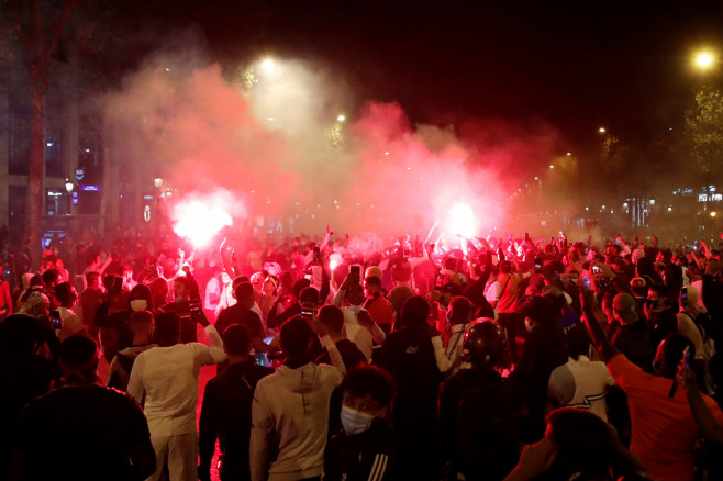 Paris St Germain fans on the Champs-Elysees after the match,