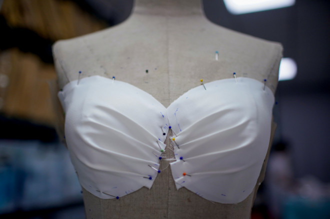Part of a wedding dress is worked on at Suzhou Jusere Wedding & Evening Dress Co. Ltd's factory,