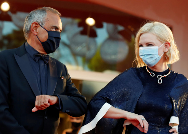 A fan wears a face mask depicting actor Cate Blanchett