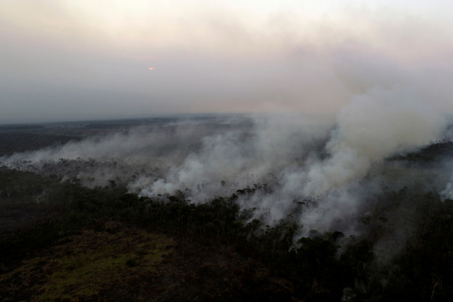 A tract of the Amazon jungle is seen burning near Ouro Preto,