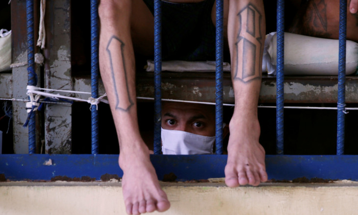 Gang members wait outside their cells