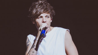 One Direction's Louis Tomlinson admits he's 'tired' of rumors that he and Harry Styles are dating and 'pissed' of 'Euphoria.' Photo by Ashley Newby/Flickr