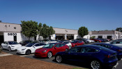 New Tesla vehicles are shown at a delivery center on the last day of the company's third quarter, in San Diego