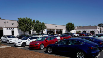 New Tesla vehicles are shown at a delivery center on the last day of the company's third quarter, in San Diego