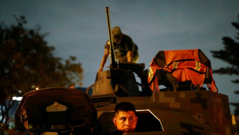 Soldiers prepare the weaponry over a war tank at the camp before attending a military parade at Independence Day celebration in Mexico City, Mexico September 16, 2019.