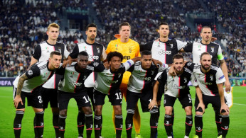 Juventus players pose for a team group photo before the match REUTERS/Massimo Pinca