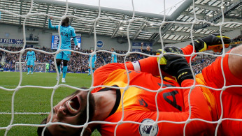 Hugo Lloris reacts after sustaining an injury as Brighton and Hove Albion's Neal Maupay scored their first goal Action Images via Reuters/Andrew Couldridge