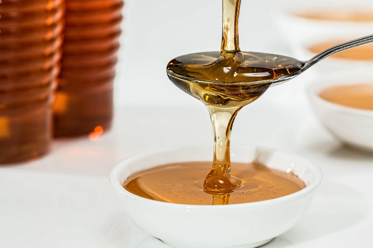 Honey on white bowl. 