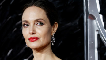 Actor Angelina Jolie poses as she attends the UK premiere of 