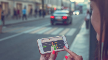 Woman using smartphone during travel.