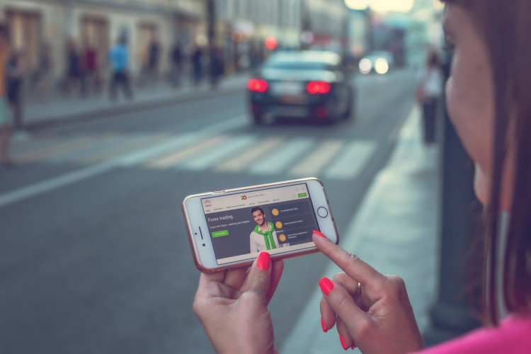 Woman using smartphone during travel.