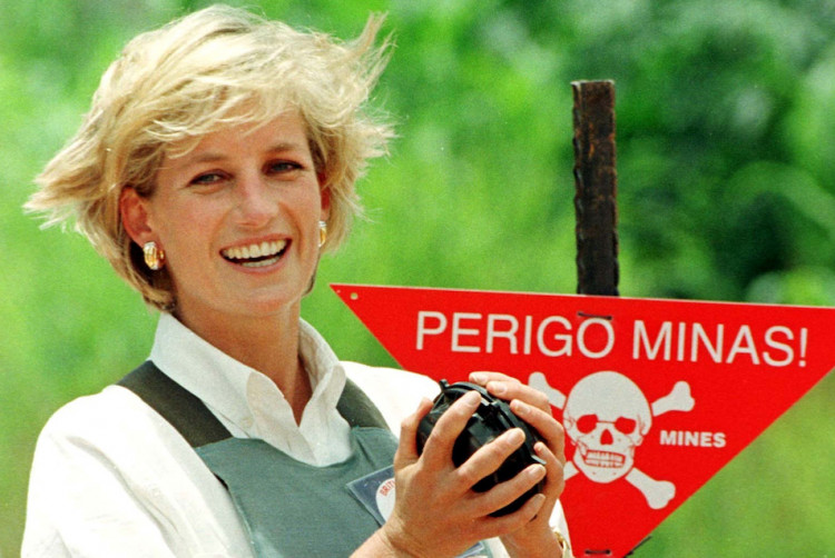 FILE PHOTO: Diana, Princess of Wales holds a landmine in one of the safety corridors of the landmine field in Huambo, Angola, January 15, 1997 during a visit to help a Red Cross campaign outlaw landmi