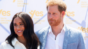 Britain's Prince Harry and his wife Meghan, the Duke and Duchess of Sussex, look on at the Youth Employment Services (YES) Hub as they visit a township in Johannesburg, South Africa, October 2, 2019. Facundo Arrizabalaga/Pool via REUTERS