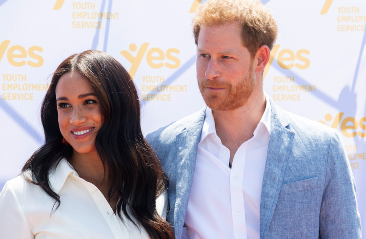 Britain's Prince Harry and his wife Meghan, the Duke and Duchess of Sussex, look on at the Youth Employment Services (YES) Hub as they visit a township in Johannesburg, South Africa, October 2, 2019. Facundo Arrizabalaga/Pool via REUTERS