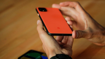 A woman takes a look on the new Google Pixel 4 smartphone displayed during a Google launch event in New York