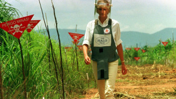 Diana, Princess of Wales walks in one of the safety corridors of the landmine field in Huambo, Angola