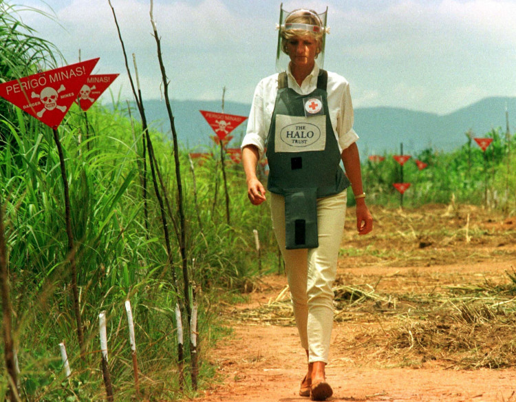 Diana, Princess of Wales walks in one of the safety corridors of the landmine field in Huambo, Angola