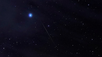 Meteors of the Orionid Meteor Shower streak through the night sky above the San Rafael Swell