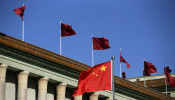 Chinese flag waves in front of the Great Hall of the People in Beijing