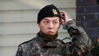 Leader of South Korean K-pop boyband BIGBANG G-Dragon leaves after being discharged from army in Yongin