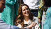 Britain's Catherine, Duchess of Cambridge receives a bracelet as she visits SOS Village in Lahore, Pakistan October 18, 2019. Picture taken October 18, 2019. Neil Hall/Pool via REUTERS