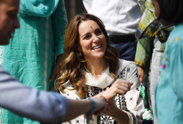 Britain's Catherine, Duchess of Cambridge receives a bracelet as she visits SOS Village in Lahore, Pakistan October 18, 2019. Picture taken October 18, 2019. Neil Hall/Pool via REUTERS