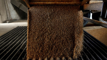 A grain trailer empties wheat into the pit at the Farmers Cooperative Exchange in Bessie, Oklahoma, U.S.