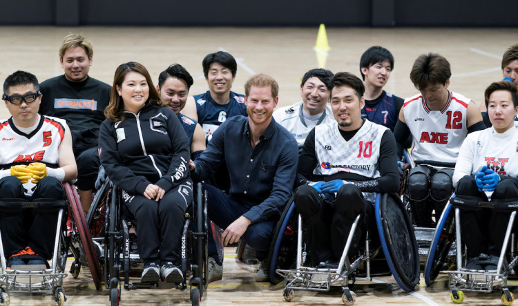 Britain's Prince Harry, Duke of Sussex, poses for a group photograph with wheelchair rugby athletes as he visits the Nippon Foundation Para Arena in Tokyo, Japan November 2, 2019. Tomohiro Ohsumi/Pool via REUTERS