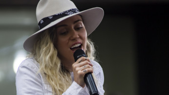 Miley Cyrus and Cody Simpson rumored to be engaged. Photo by Mass Communication Specialist 3rd Class Casey J. Hopkins/Wikimedia Commons