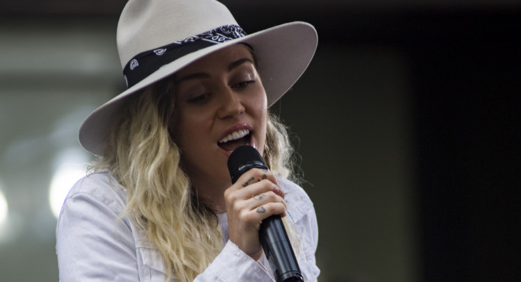 Miley Cyrus and Cody Simpson rumored to be engaged. Photo by Mass Communication Specialist 3rd Class Casey J. Hopkins/Wikimedia Commons