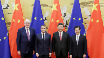 (L-R) EU Trade Commissioner-designate Phil Hogan, French President Emmanuel Macron, Chinese President Xi Jinping and Chinese Commerce Minister Zhong Shan