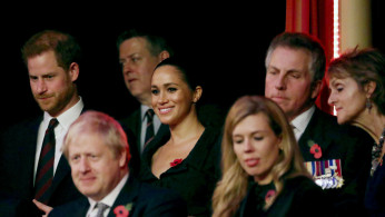 Britain's Prince Harry, Meghan, Duchess of Sussex, Prime Minister Boris Johnson and Carrie Symonds attend the Royal British Legion Festival of Remembrance at the Royal Albert Hall in London