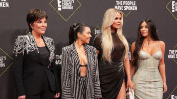 Kris Jenner with Kourtney, Khloe, and Kim Kardashian.