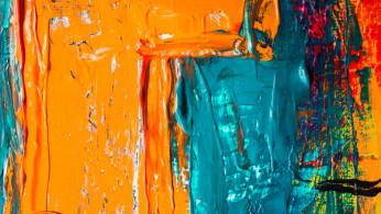 Shade of orange and blue abstract paint.