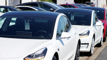 A new Tesla Model 3 is shown at a delivery center on the last day of the company's third quarter, in San Diego