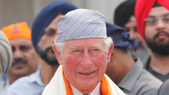 Britain's Prince Charles stands during his visit to a Gurudwara (Sikh temple) in New Delhi