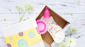 Pink menstrual cup in a box.